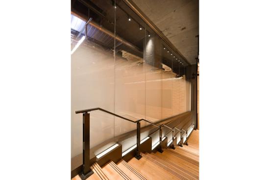 Partition wall in ViviGraphix Gradiance glass with Standard finish and Scatter interlayer at the Elinor Bunin Munroe Film Center in New York, New York