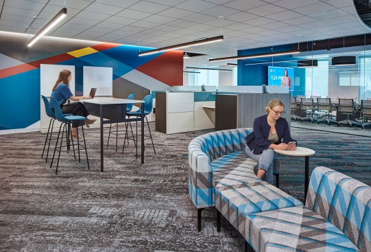 A variety of collaboration areas are scattered throughout the office.