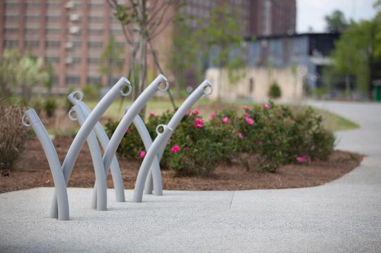 Bike Garden Bike Racks shown in cast-in-place configuration with Aluminum Texture powdercoat at Historic Fourth Ward Park, Atlanta, Georgia