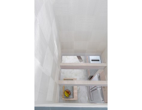 Light wells, fed by solar tubes, bring daylight to the deep portions of the house