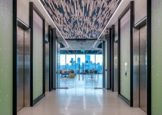 Visitors are welcomed into the 17th Floor Customer Experience Center by a programmed ceiling light that moves in a flowing sequence, drawing visitors inside. 