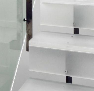 One inch gaps beneath each riser enhance the effect of airiness and transparency.