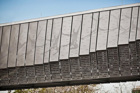 Bridge upper panels in Stainless Steel with Sandstone finish and custom Eco-Etch pattern; lower panels in Stainless Steel with Sandstone finish and custom screen pattern at the Houston Ballet Center for Dance, Houston, Texas