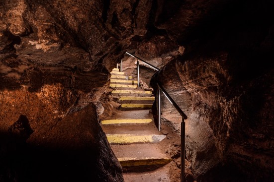 Illuminated cavern stairway.