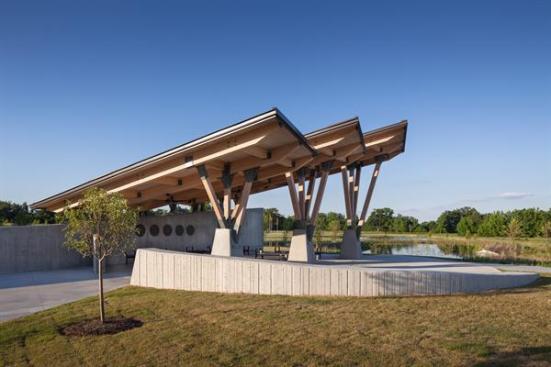 Glue-laminated+superstructures+rest+on+wood+columns+on+the+south+side%2c+while+a+board-formed+concrete+bearing+wall+offers+privacy.