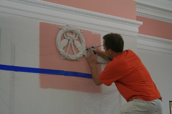 Craftsman restoring decorative plaster