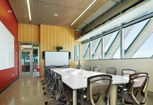 Glazed walls in the classrooms allow views of the building?s shading system, including diagonal aluminum fins on the east and west fa?ades.