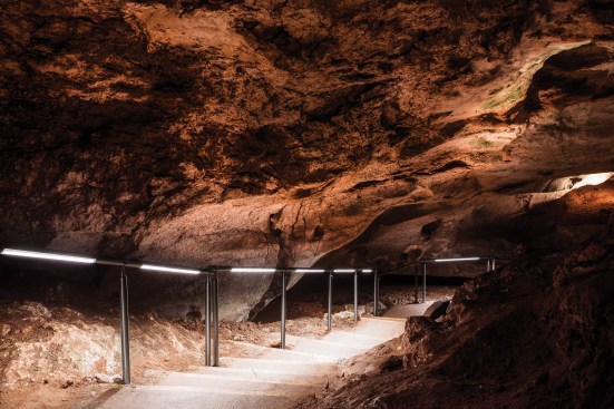 Illuminated cavern stairway.