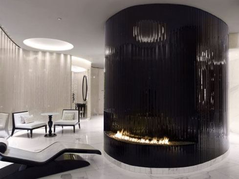The seating areas are lit with narrow beam LED spotlights concealed in slots that follow the curved walls and highlight the rich wall finishes. The use of reflected LED lighting inside the coffers gives a warm and relaxing feel throughout.