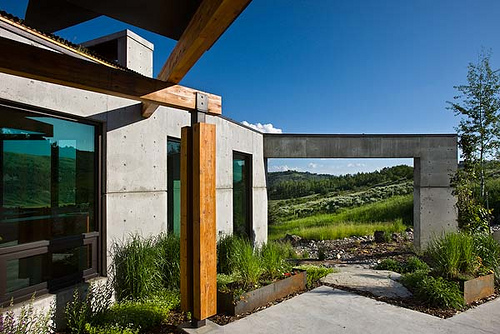 Exterior, horizontal, view out through flying buttress from entry, Landes-Oatey residence, Jackson, Wyoming; Ward + Blake Architects