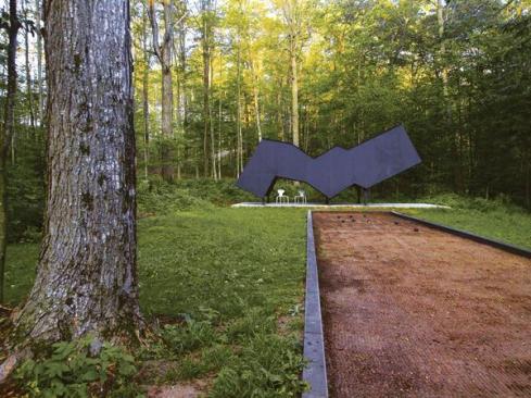An abstract viewing pavilion overlooks the bocce court. 