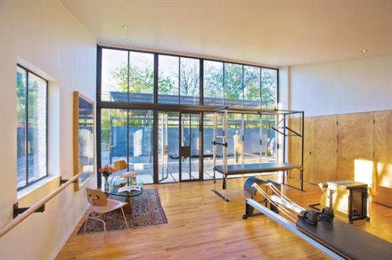 The projects roof soars to 11 feet at the high end, bringing natural light to the studio. 
