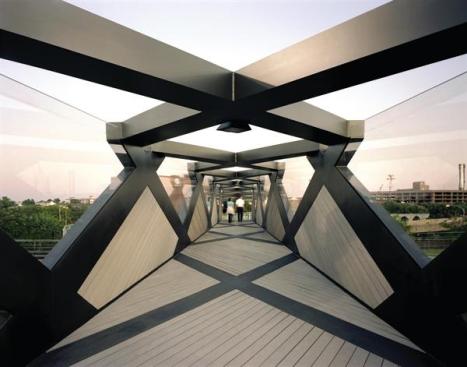 The new Weave Bridge at the University of Pennsylvania creates a pedestrian passage over the Amtrak train tracks that currently separate the main campus from athletic fields along the Schuylkill River.