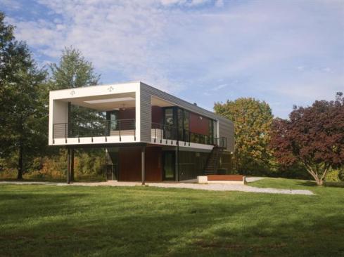 Mahogany panels warm the metal and fiber-cement exterior.