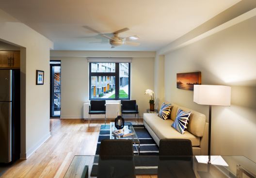 A typical townhouse unit. Ceiling fans and dual-fa&ccedil;ade operable windows encourage natural cooling through cross-ventilation.