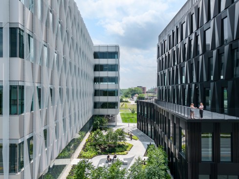 A balcony from Digital Futures 2 overlooks a parklet that nestles between the two buildings.