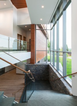 The connecting stair reintroduces the exterior materials.