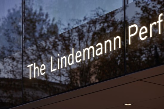 Building identity signage integrated into the glass curtain wall