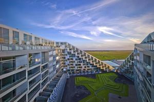 8 House  Copenhagen  Overlooking the Copenhagen Canal, the 645,000-square-foot, bow-shaped 8 House includes apartments, townhouses, and penthouses, in addition to retail space.