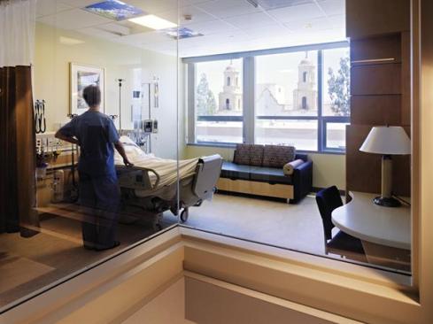 Patient rooms on the upper floors feature operable windows to allow air circulation and natural light as well as luminous artificial skylight panels?backlit glass panels printed with photos of blue skies and flowering tree canopies?above patient beds to provide a respite for bedridden patients. Resilient flooring: Forbo; Marmoleum; forbo.com - Artificial Skylight: Sky Factory; Luminous SkyCeiling in Skies and Blossoms; theskyfactory.com - Ceiling: USG; Lay-in acoustical ceiling tiles; usg.com - Wall Base: Burke; 4" BurkeBase rubber wall base in 209 Gray-Beige; burkeflooring.com