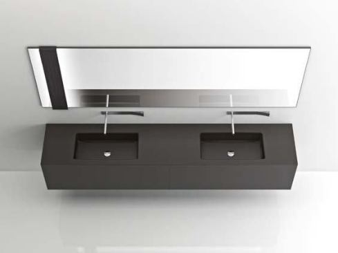 The wall- or mirror-mounted LED light illuminates from one or two sides behind panels available in different finishes, including wood and Corian. Cabinets, Soho line.