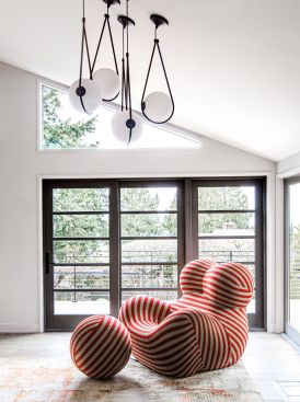 It all began with the red striped chair.
A rebellious 1969 creation by designer Gaetano Pesce, the “Serie Up” chair has a story: Its shape was meant as a political message, one denouncing the treatment of women in the world.
Full of style and meaning, it perfectly represents the flair of this colorful, vibrant couple.