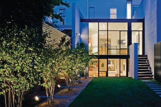 The sleek addition vastly improves the projects connection with its rear yard. 