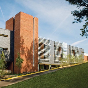SOUTH ADDITION, 2008 Designed by associate dean William Sherman in collaboration with SMBW Architects, the South Addition adds 26 new faculty offices to the building?a boon in a school whose faculty has tripled since the building?s completion. The addition?s adjacency to the design studios on the third and fourth floors (the faculty had previously been segregated on the lower levels) greatly improves communication with students. ?It?s a way to reorganize the way the institution works, as well as the interaction between faculty and students,? Sherman says. The south fa?ade reflects Sherman?s interest in buildings that respond to climate. The exterior wall incorporates a louver system that combines frosted and clear glass panels that open and close in response to the sun?s movement. Open during the day, they admit light directly into the building; closed at night, they trap the accumulated day?s warmth, creating a greenhouse effect on the porches that connect faculty offices. Faculty Architect: William Sherman Architect of Record: SMBW Architects Structural: Fox & Associates Civil Engineer: Draper Aden Associates M/E/P: Hurd & Obenchain Contractor: Donley?s Construction