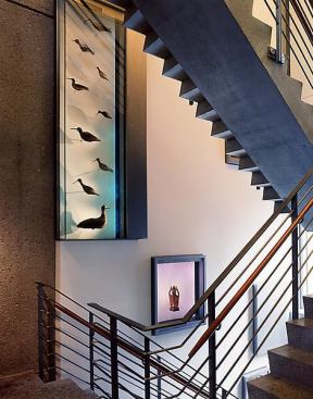Built-in niches displayed artifacts from the museum's permanent collection, framing pieces in unexpected locations throughout the building.