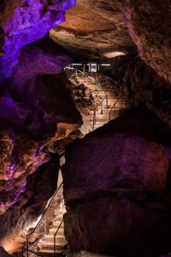 Illuminated cavern stairway.