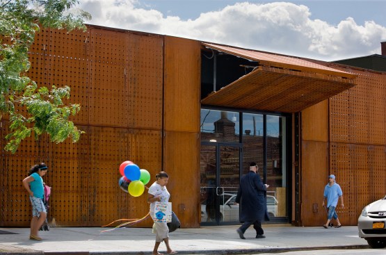 Closed panels provide shop security; open panels provide shading.