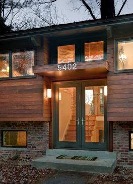 The home's revamped exterior still echoes its 1960s past but preserves it in a more contemporary manner.