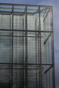 The stainless steel screen is located within the cavity at 22 inches in front of the inner glass layer and is composed of a pattern of triangular-shaped bars.