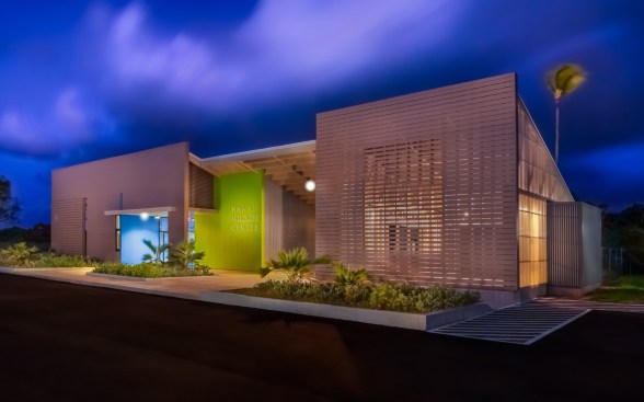 At night the education pavilion (far right) and open-air lanai glow from within