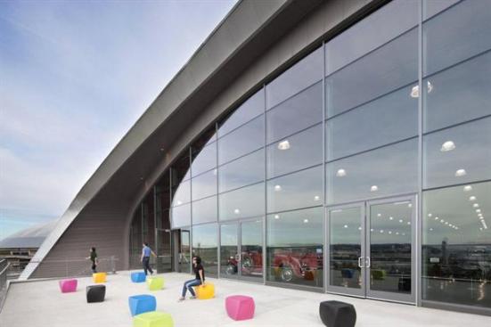 A+standing-seam+metal+roof+finishes+the+building.