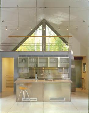 The interior is sparsely detailed for easy maintenance, with plenty of space for guests to mingle.