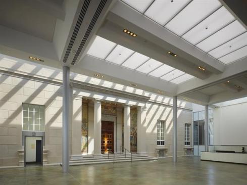 The original 1929 fa?ade is preserved in a winter garden linking the south addition to the existing structure. Used as an event space, a caf?, and a welcome daylit respite from hard New Hampshire winters, the space features a large central skylight that contains two layers of perforated stretch vinyl fabric from NewMat, which help to cut down on glare and dampen the reverberant acoustics.