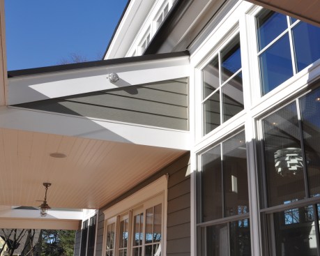 Detail of the roof cutouts on the front porch.  The cutouts allow southern light to flood the large open space within.