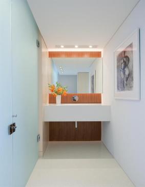 Throughout the apartment, clear and translucent glass unifies and defines the flowing floor plan.