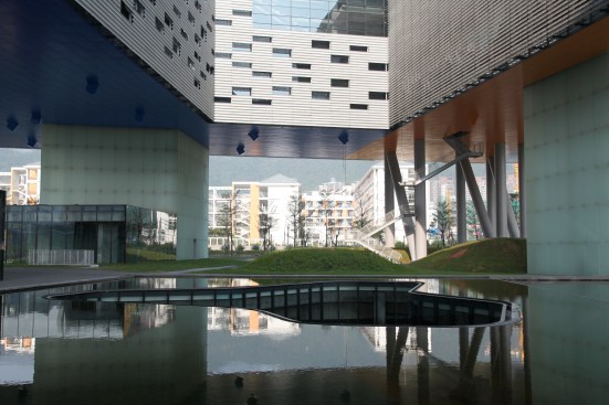 A hole in the water feature reveals several layers of structure underground.