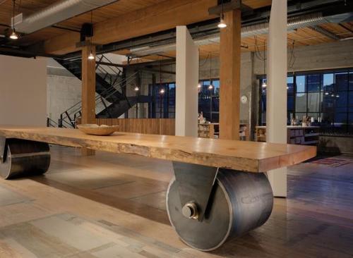 The movable table, inspired by the work of George Nakashima, was center-cut from an old growth tree that died naturally and retains the trees contours.