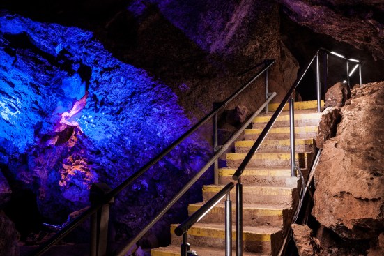 Illuminated cavern stairway.