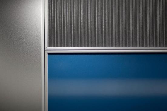LEVELe Wall System with Capture panels; insets in Bonded Aluminum with Dark Patina and Delta pattern; Stainless Steel with Seastone finish; and ViviChrome Chromis glass with custom color interlayer and Standard finish at 101 Capitol Centre, Jackson, Mississippi