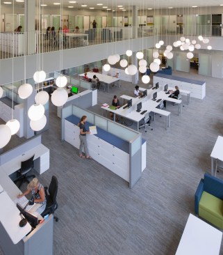 A suite of faculty offices and workstations anchor the north side of the building.
