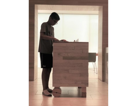 A  wheelbarrow kitchen island and the diffused light of the bubble wrap enclosure.