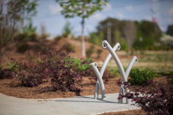 Bike Garden Bike Racks shown in cast-in-place configuration with Aluminum Texture powdercoat at Historic Fourth Ward Park, Atlanta, Georgia