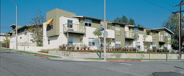 The architects stacked the apartments to make framing and plumbing easier, and composed 10 units along the front elevation to look like several homes.