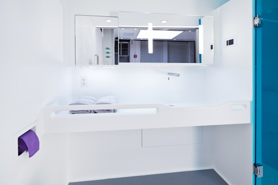Bendheim+custom-fabricated+the+low-iron+mirror+above+the+sink+to+enable+designers+to+create+a+special+back-lighting+effect%2c+seen+on+the+panel+to+the+right.+