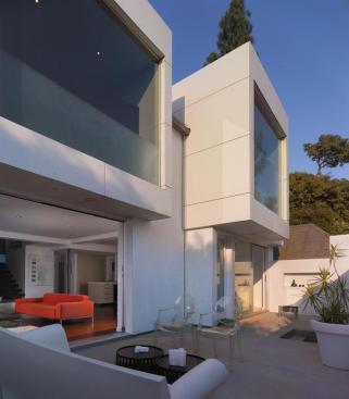 Clad in Ivory Carat concrete boards, the two window boxes stand as sentinels over the revamped entry courtyard. 