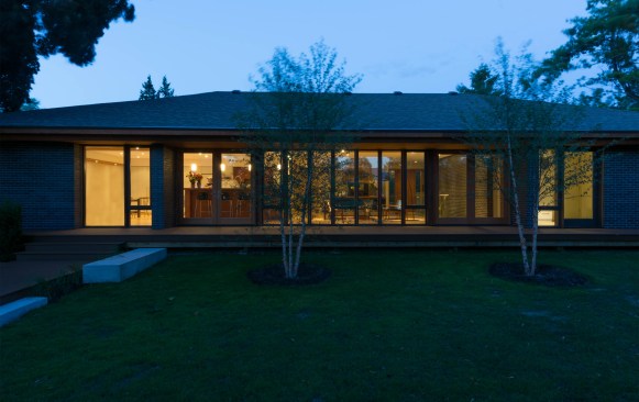Rear elevation shows transparency and connection to the outdoors